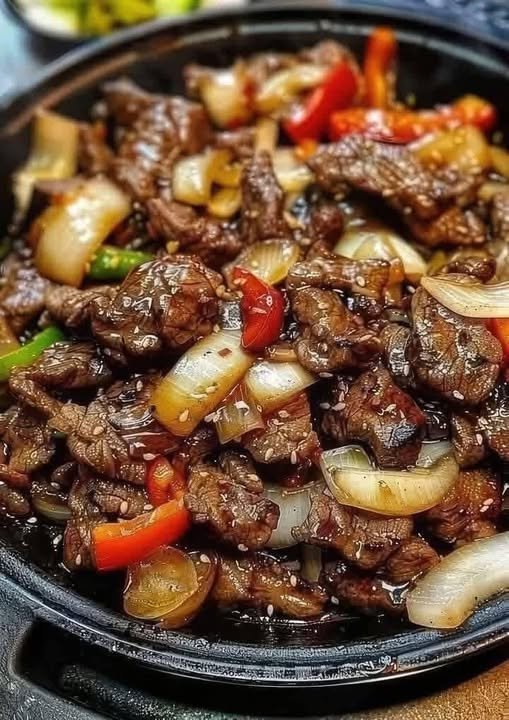 Sizzling Chinese Pepper Steak with Onions: A Fusion of Flavors